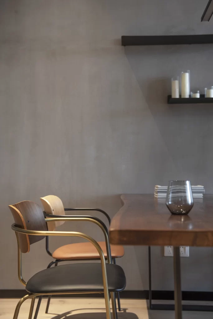 Contemporary Dining Space Neutral Tones Minimalist Design Wooden Table Black Chairs