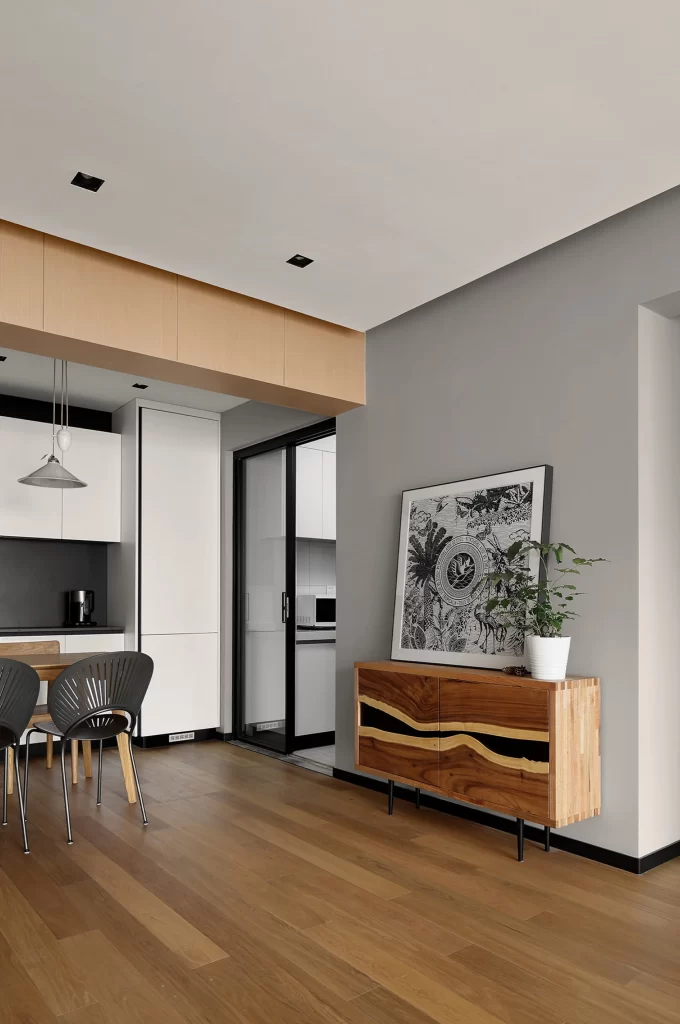 Contemporary Kitchen Dining Area Neutral Tones Wooden Flooring Black Accents