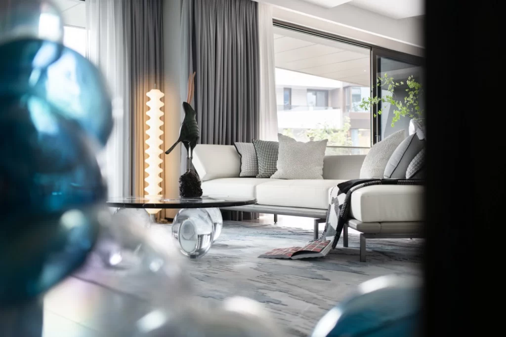 Contemporary Living Room Neutral Tones Glass Accents Modern Furniture