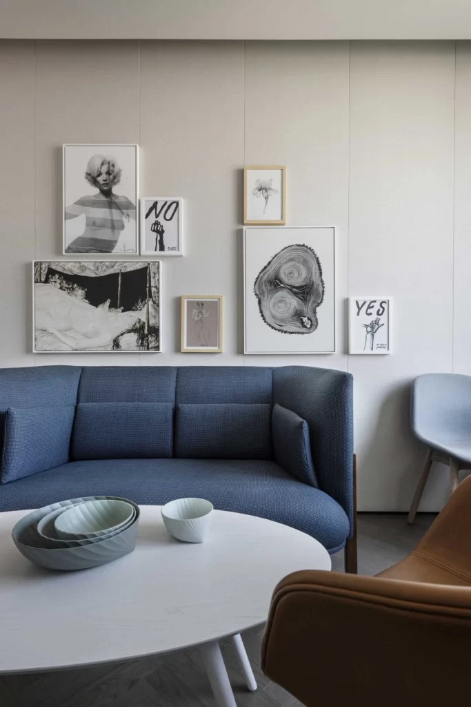 Contemporary Living Space Blue Sofa Neutral Tones Artistic Wall Decorations