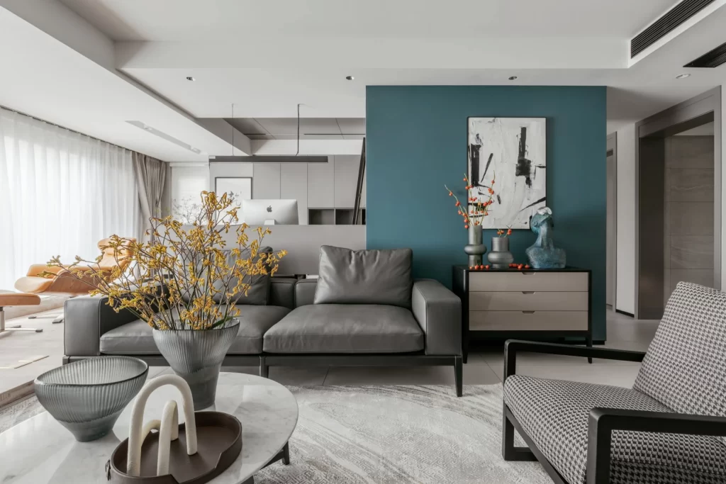 Contemporary Living Space Neutral Tones Blue Accent Wall Minimalist Furniture