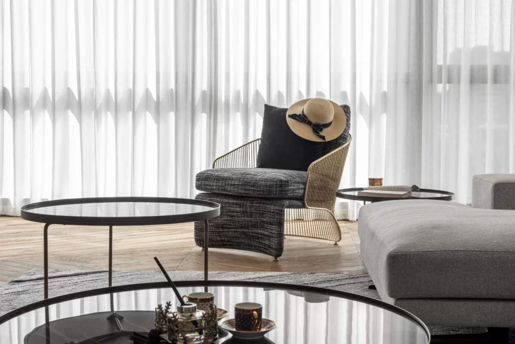 Contemporary Living Space Neutral Tones Glass Furniture Soft Textures