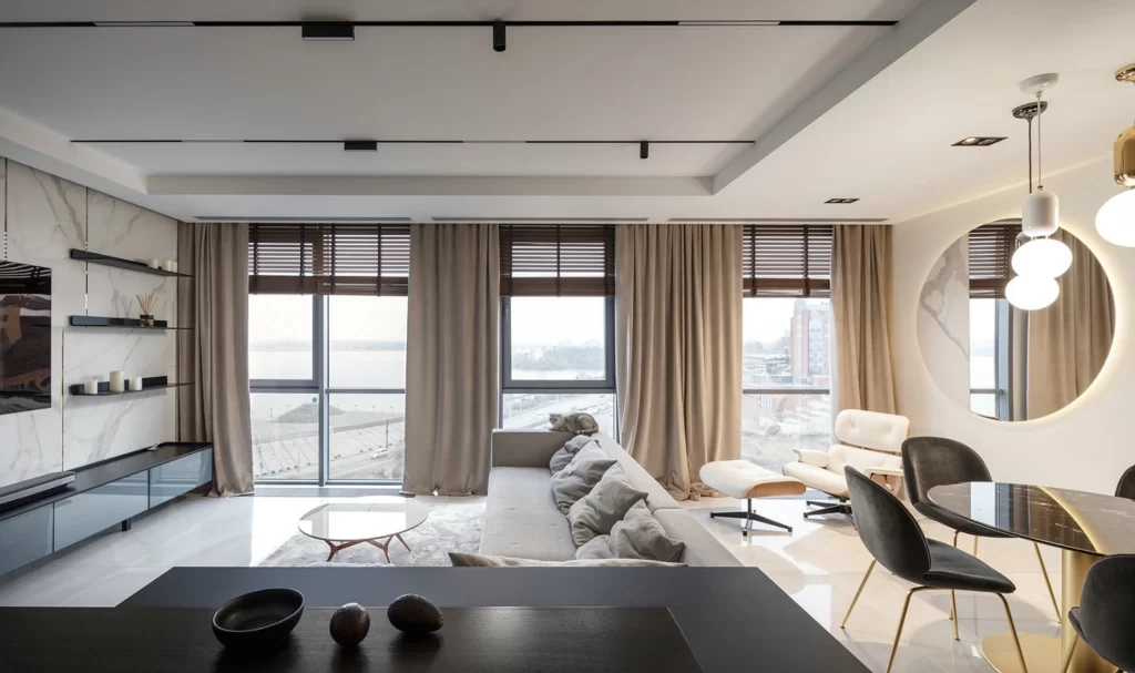 Contemporary Living Space Neutral Tones Large Windows Minimalist Furniture