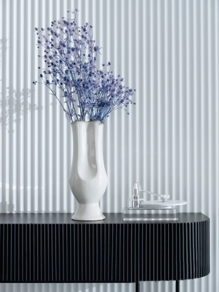 Contemporary Minimalist Console Table White Vase Purple Flowers Black Accents