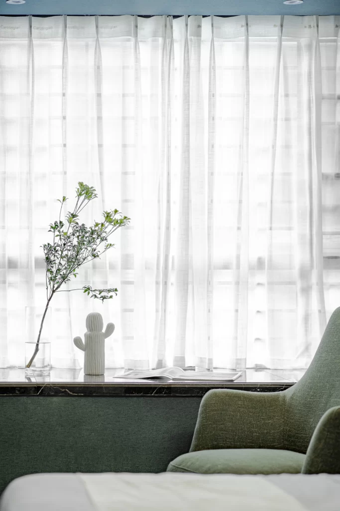 Contemporary Minimalist Living Space Soft White Green Accents Natural Light