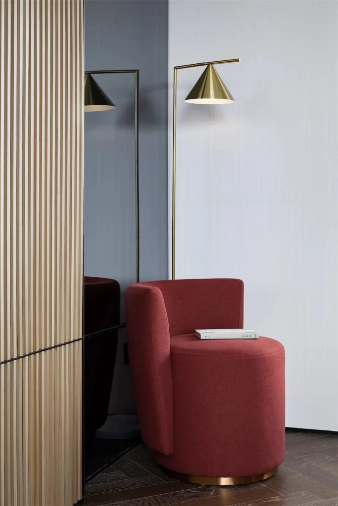 Contemporary Red Velvet Chair Gold Floor Lamp Neutral Wall