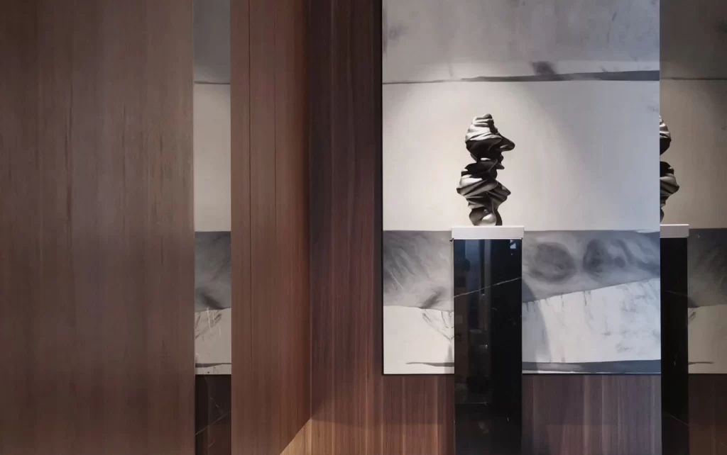 Contemporary Sculpture Gallery Neutral Tones Marble Walls Wood Paneling