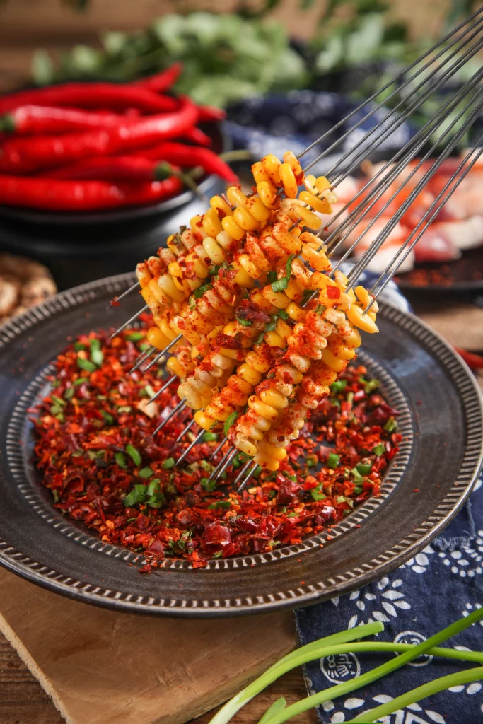 Corn Skewers Spicy Chili Crust Golden Yellow Plated