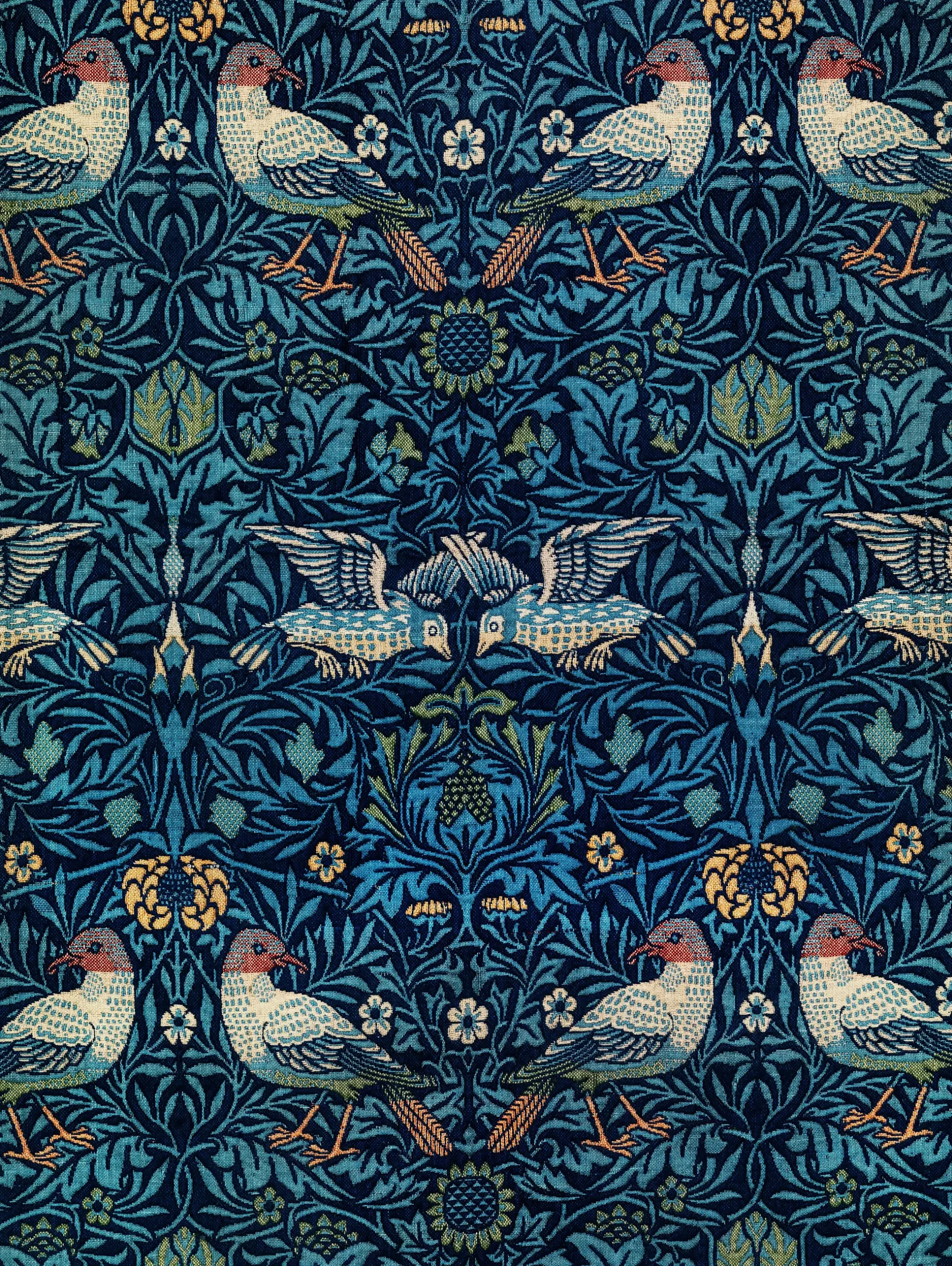 Blue and gold floral vine pattern with birds William Morris