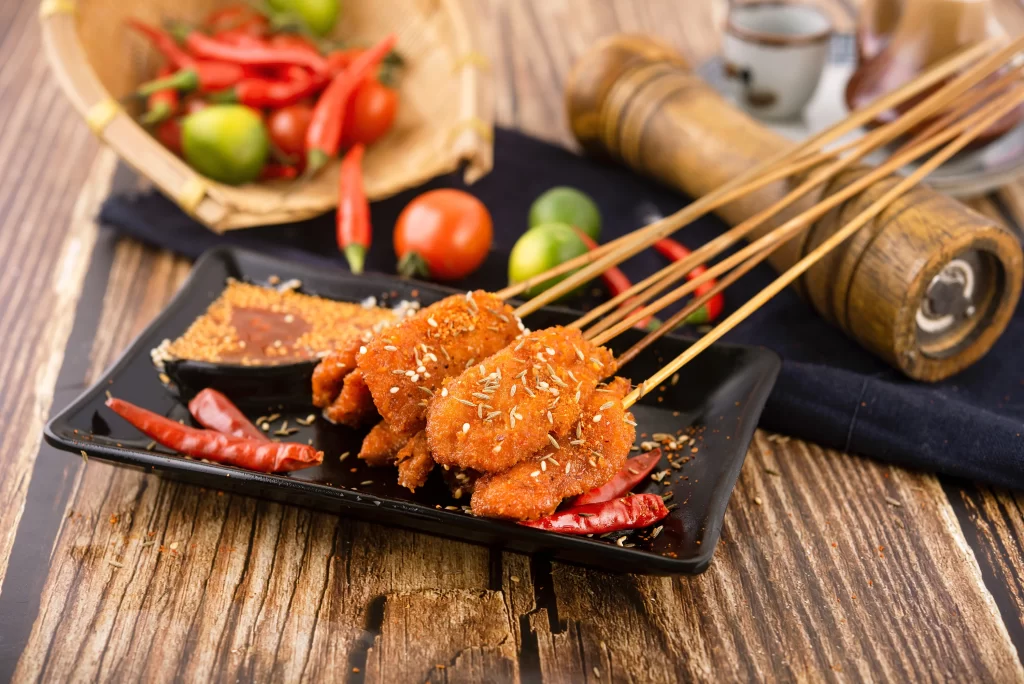 Crispy Chicken Skewers Spicy Sauce Red Chili Garnish