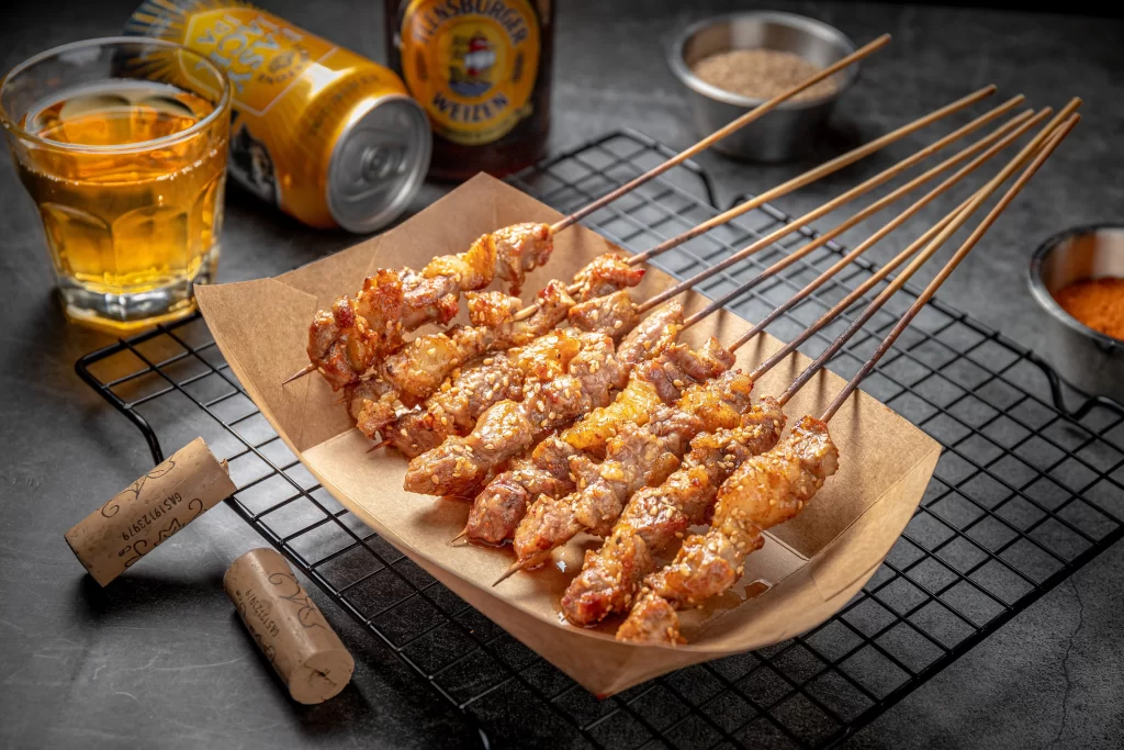 Crispy Pork Skewers Golden Brown Charred Garnish