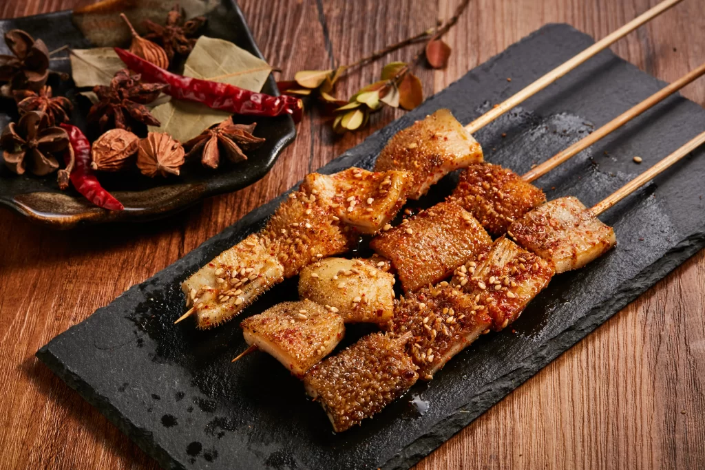 Crispy Pork Skewers Sesame Seeds Spicy Sauce Black Slate