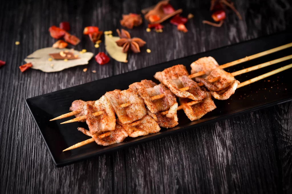 Crispy Pork Skewers Spicy Seasoning Black Plate