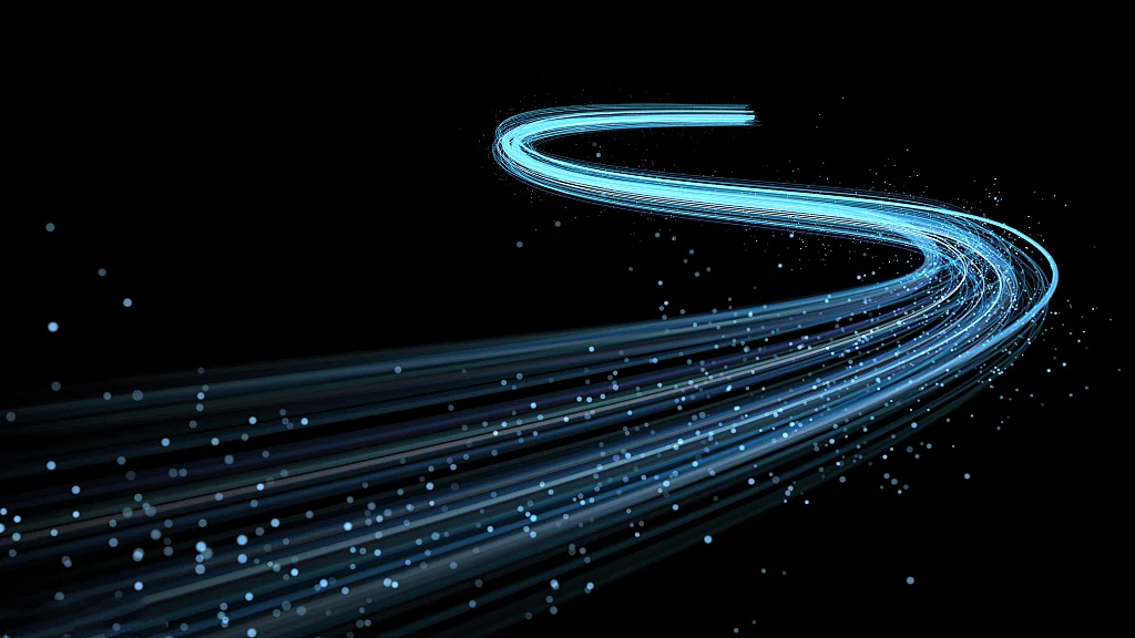 Electric Blue Spiral Light Trails Dark Background