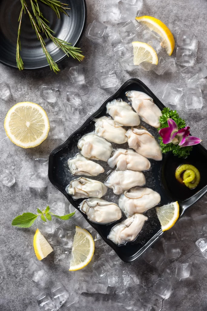 Fresh Oysters on Ice with Lemon and Garnish