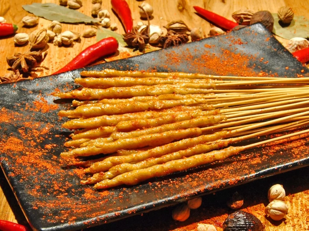 Golden Brown Chicken Skewers on Black Rectangular Plate (50).JP