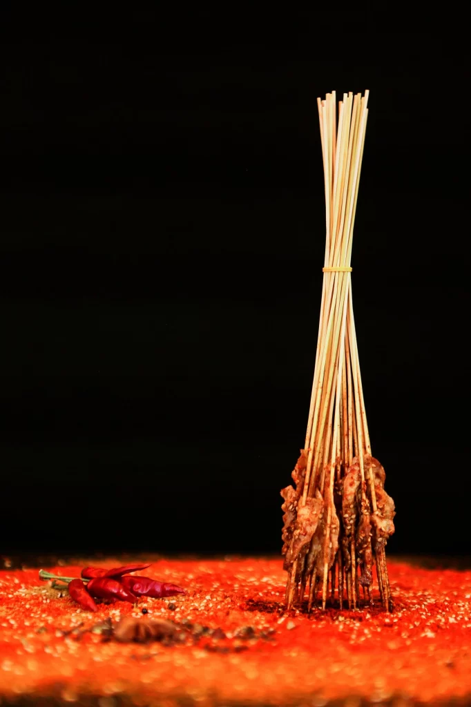 Golden Brown Chicken Skewers with Reddish Spices and Chilies