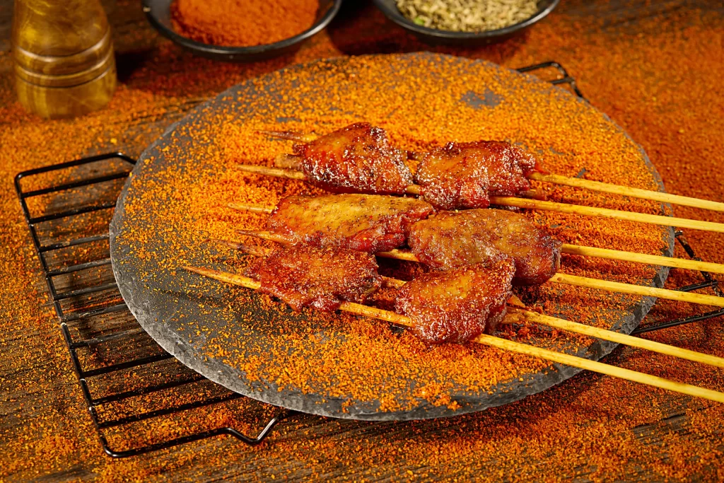 Golden Brown Chicken Wings on Black Slate Plate
