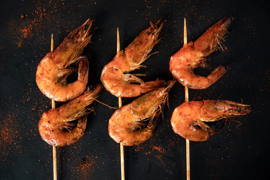 Golden Brown Grilled Shrimp on Dark Slate Plate