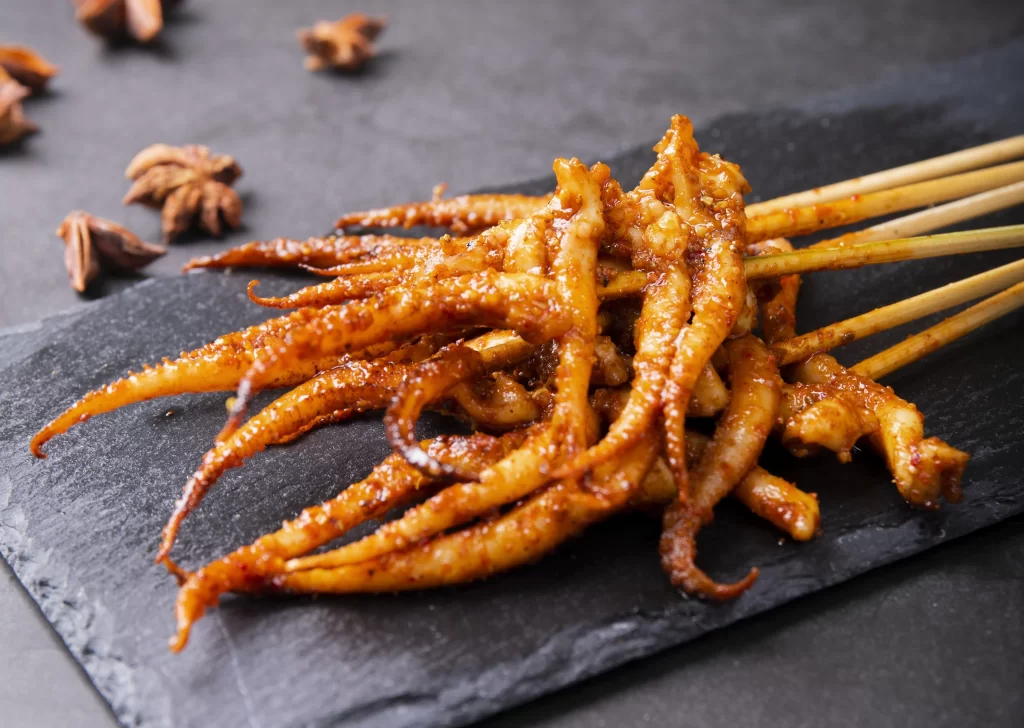 Golden Brown Octopus Tentacles Grilled with Spices on Slate