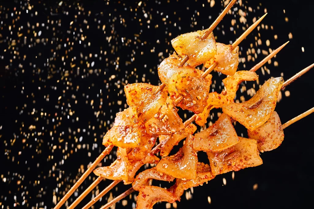 Golden Brown Pork Belly Skewers with Crispy Skin and Spices