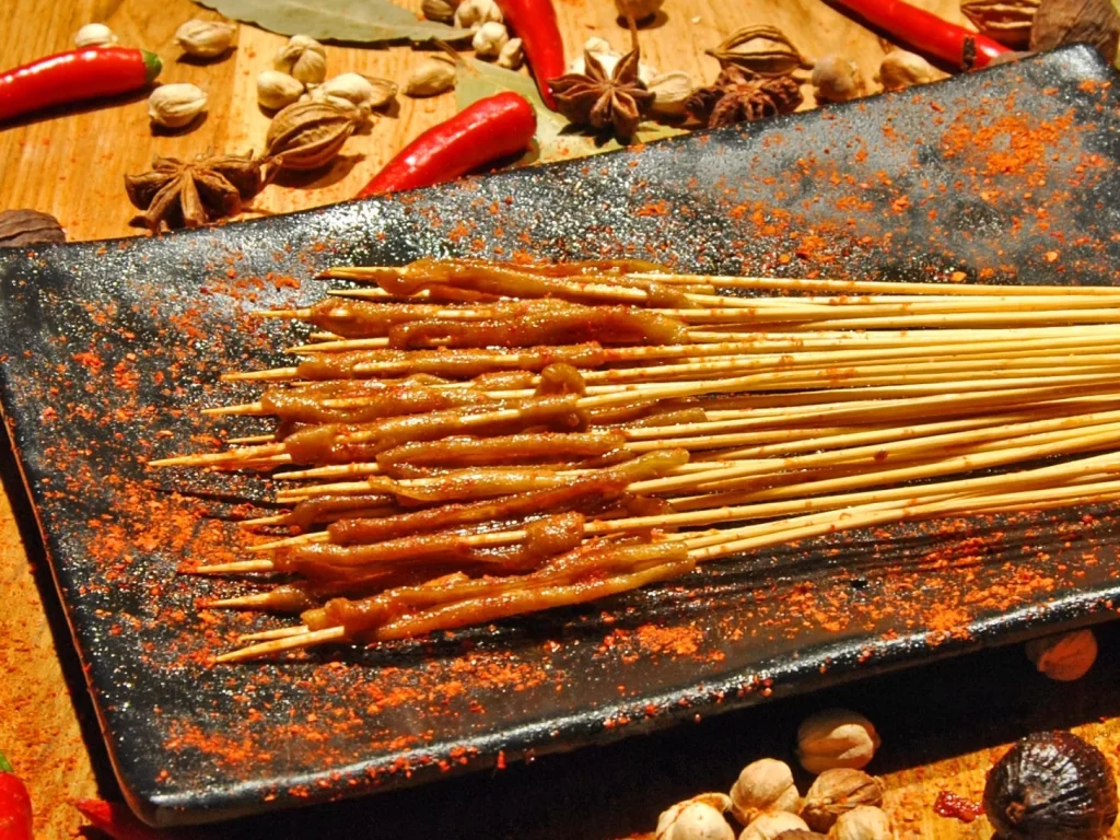 Golden Brown Pork Skewers on Black Rectangular Plate (46).JP