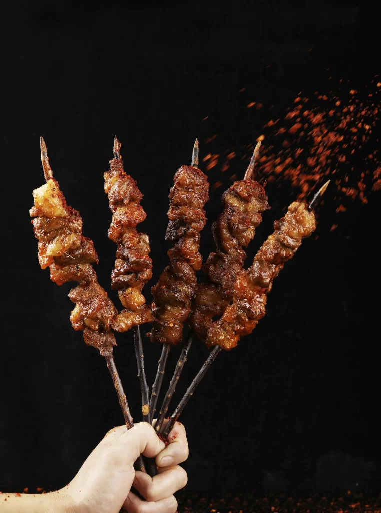 Golden Brown Pork Skewers with Reddish Char and Spices