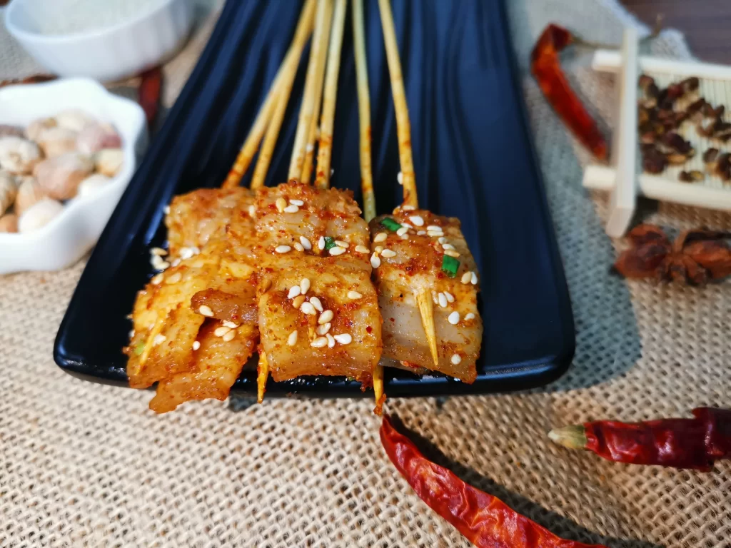 Golden Brown Pork Skewers with Sesame and Green Onions