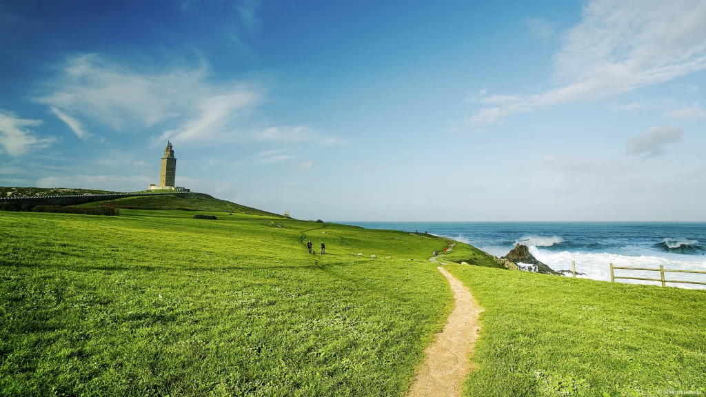 Green Grass Pathway Ocean Blue Sky Tower