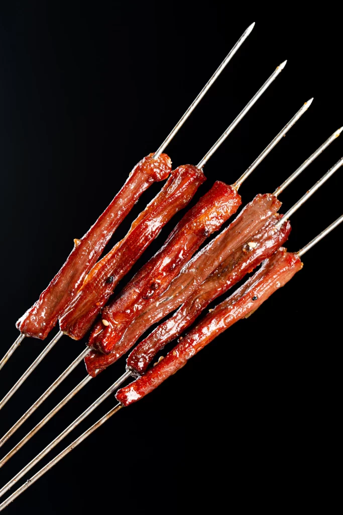 Grilled Beef Skewers Charred Crust Golden Brown Close Up