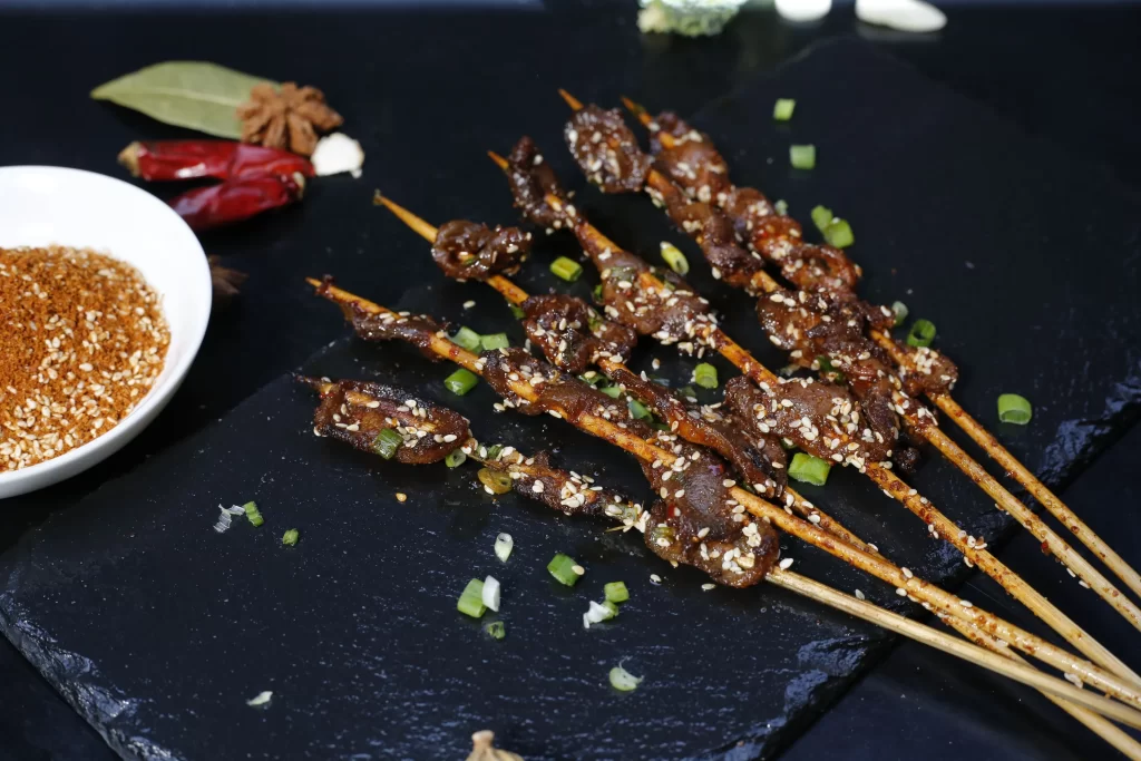Grilled Beef Skewers Sesame Seeds Green Onion Garnish
