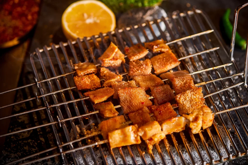 Grilled Chicken Skewers Charred Golden Brown Lemon Garnish