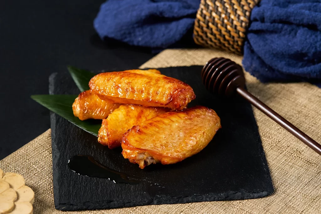 Grilled Chicken Wings Honey Glaze Crispy Skin Plated