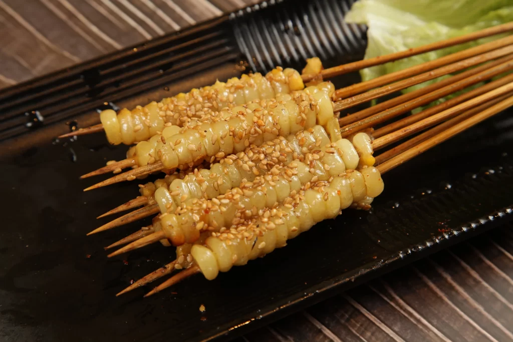 Grilled Corn Skewers Sesame Seeds Golden Brown Plate