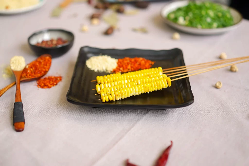 Grilled Corn Skewers Spices Golden Yellow Plated