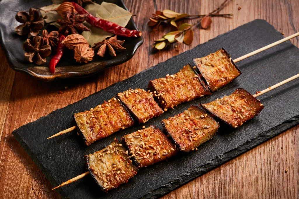 Grilled Eggplant Skewers Sesame Seeds Spicy Sauce Charred Edges