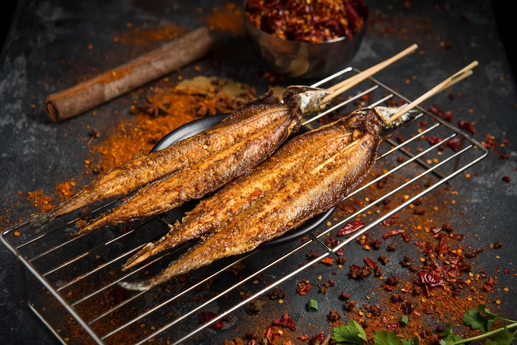 Grilled Fish Skewers Spicy Sauce Charred Appearance