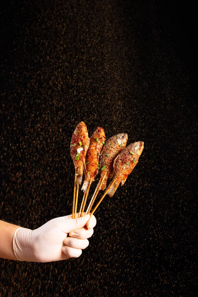 Grilled Fish Skewers Spicy Sauce Green Onion Garnish