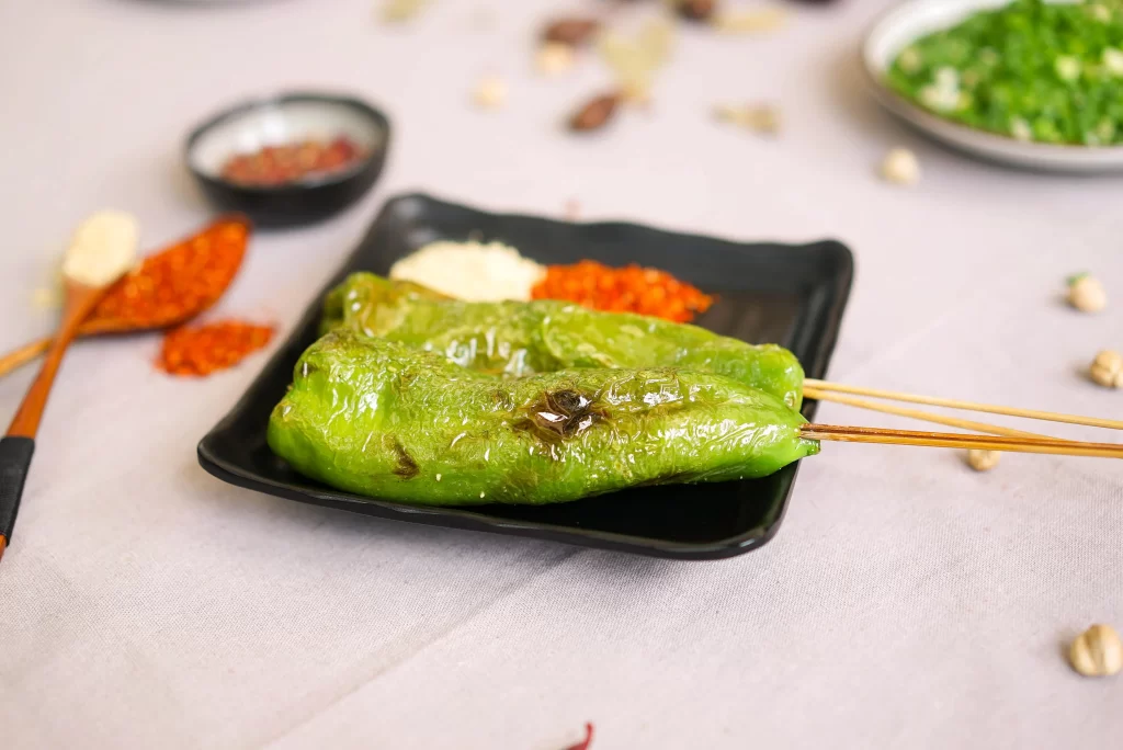 Grilled Green Peppers Charred Crust Black Plate