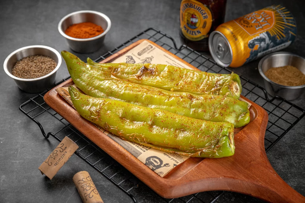 Grilled Green Peppers Spices Charred Edges Rustic Platter