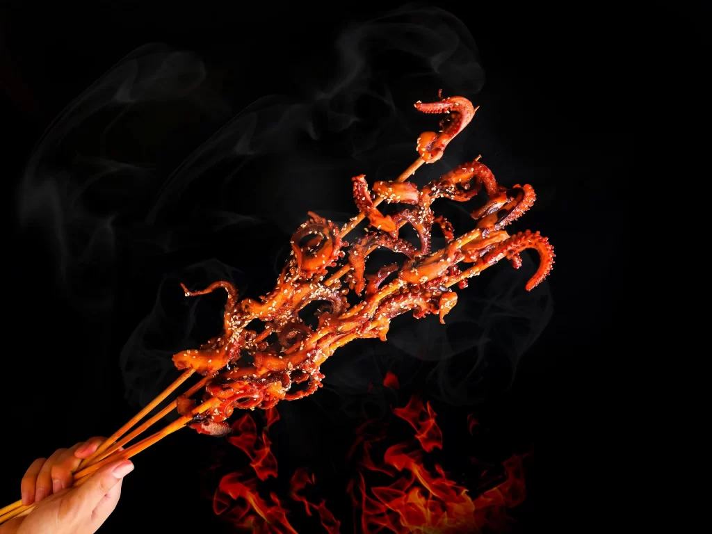 Grilled Octopus Skewers Charred Tentacles Smoke Rising