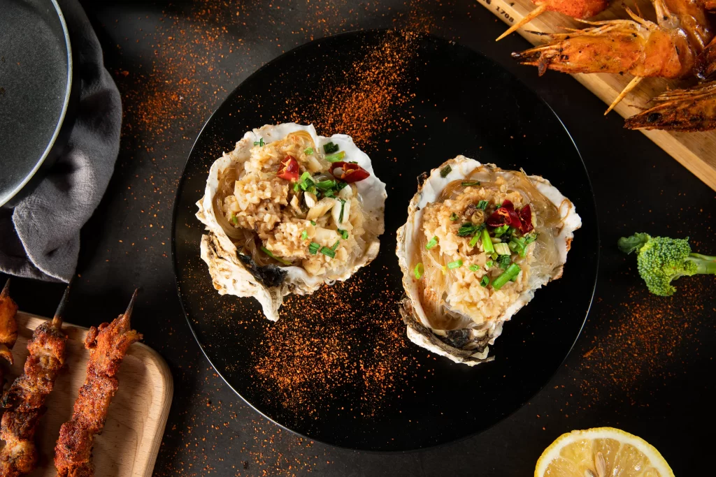 Grilled Oysters with Garlic and Chili Garnish