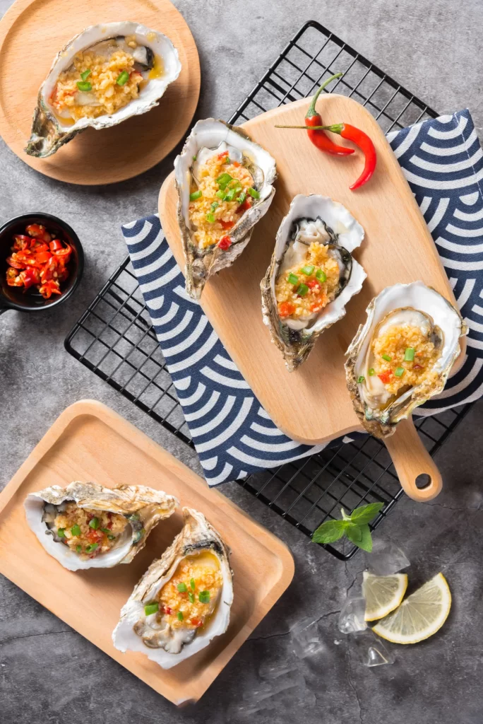 Grilled Oysters with Garlic Chili Sauce Fresh Herbs