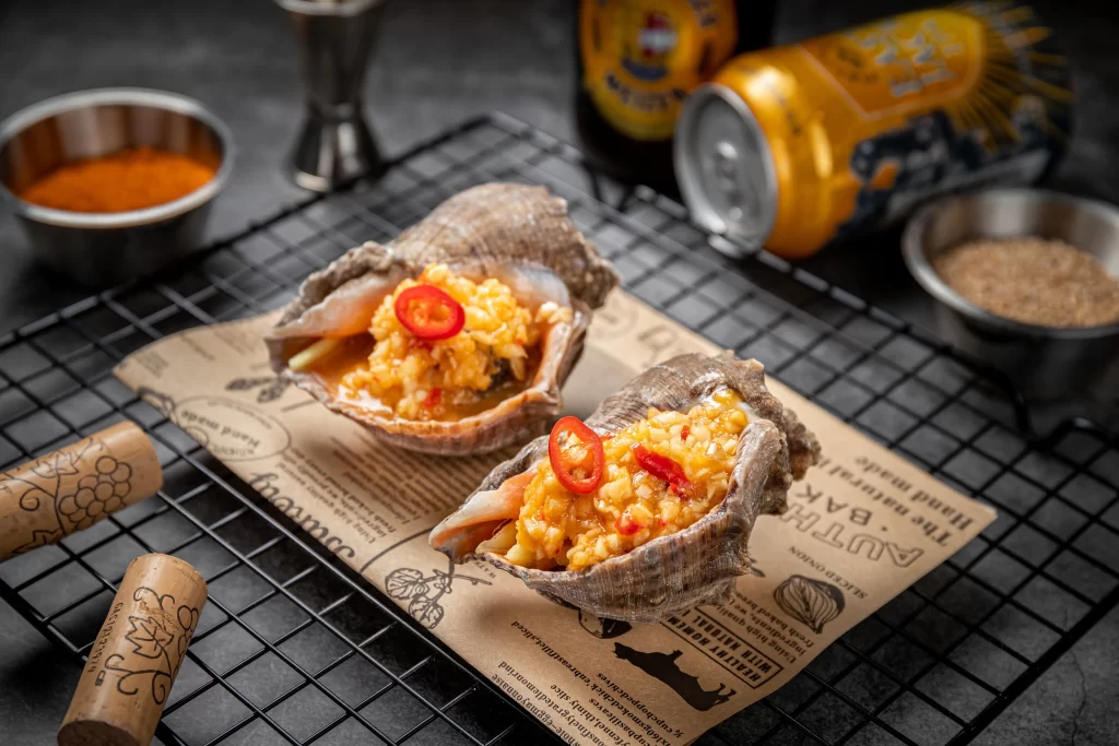 Grilled Oysters with Spicy Corn and Chili Garnish