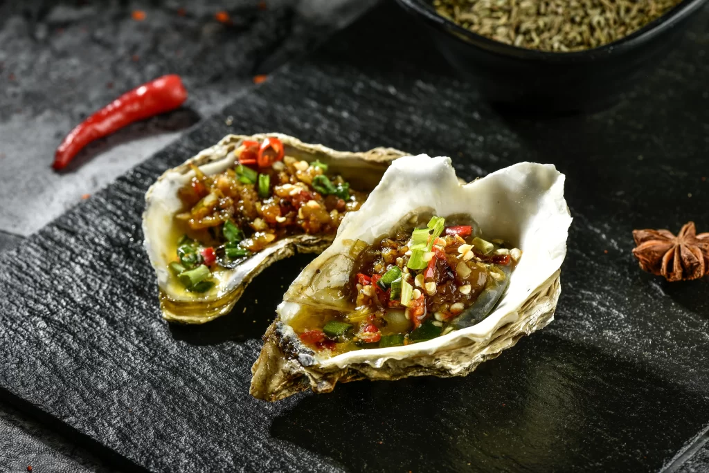 Grilled Oysters with Spicy Garlic Topping Charred Shell