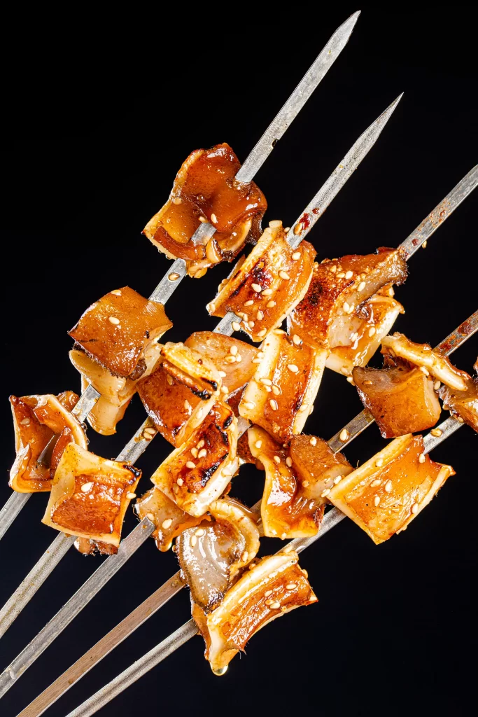 Grilled Pork Skewers Charred Crust Sesame Seeds