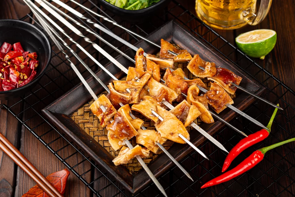 Grilled Pork Skewers Charred Edges Golden Brown Garnish