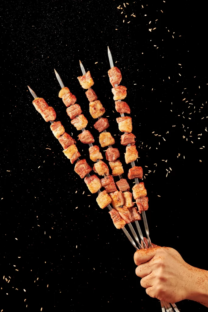 Grilled Pork Skewers Spices Golden Brown Hand Held