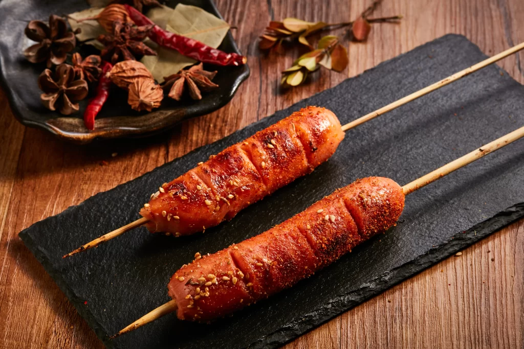 Grilled Sausage Skewers Charred Sesame Seeds Black Slate
