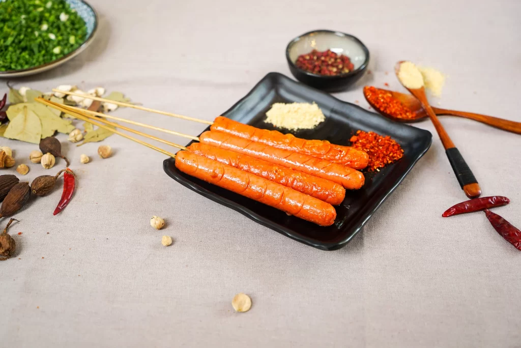 Grilled Sausage Skewers Spices Charred Crust Black Plate